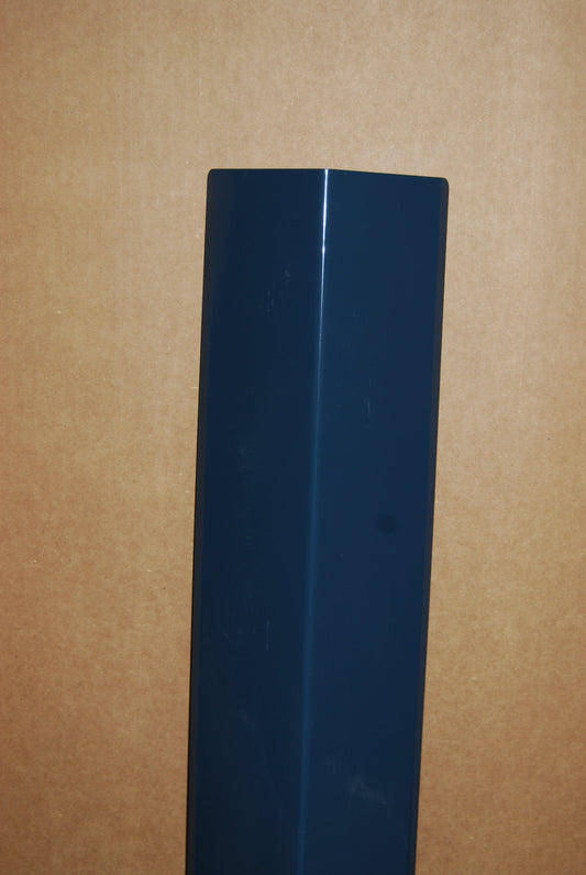 A dark blue plastic or metal rectangular component with two circular cutouts on one end, shown on a plain brown background.